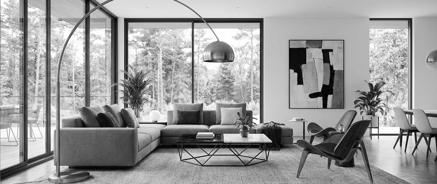 A modern living room interior with layered furniture, art and natural light